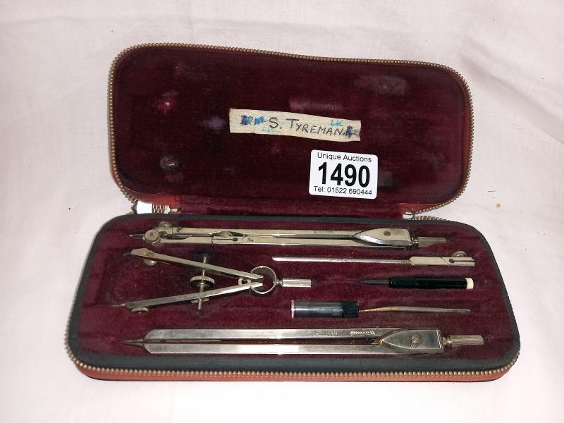 A cased compass set