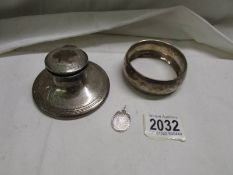 A hall marked silver inkwell, a silver pendant and an EPNS bangle.