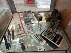 Retro stationery items and personal aids, pens and calculator, binocular, lighters, keyrings etc