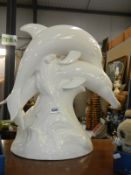 A large china figure with 2 Dolphins A/F - small chip