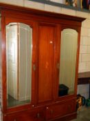 An inlaid Victorian mahogany 2 mirror door wardrobe