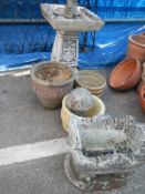 A bird bath & plant pots