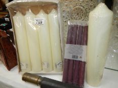 A quantity of large wax candles