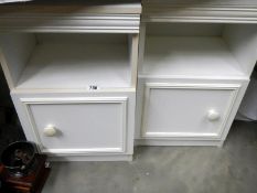 A pair of bedside cabinets in good order