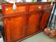 A mahogany glass top dresser base