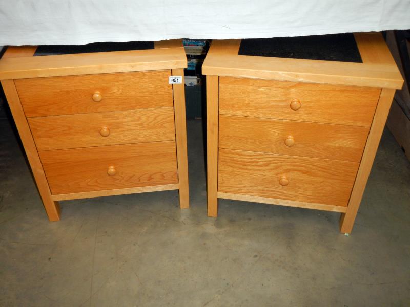 A pair of good clean bedside cabinets with marble tops