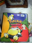 A folder of Pokemon & Yu Gi Oh cards and loose sets.