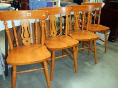 A set of 4 pine kitchen chairs
