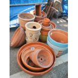 A quantity of terracotta plant pots