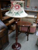 A mahogany standard lamp