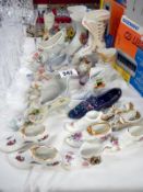 A good selection of old 20th century collectors china shoes