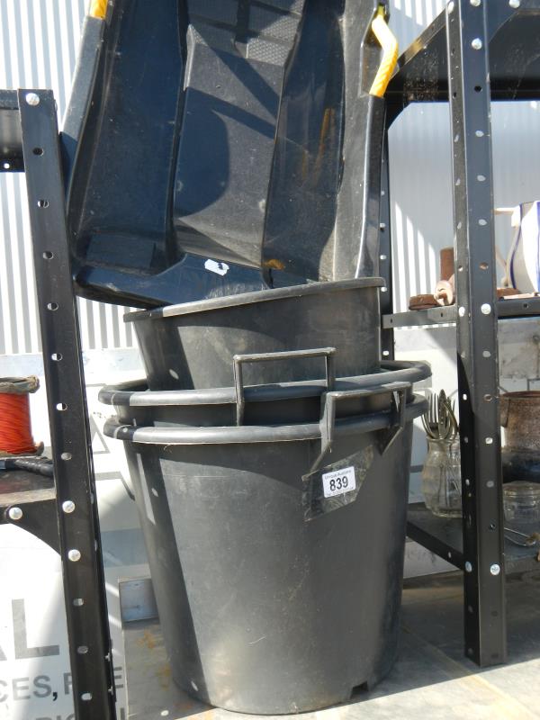 A quantity of plastic bins and a snow sledge