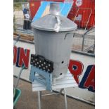 An aluminium table, stool & paper burning bin