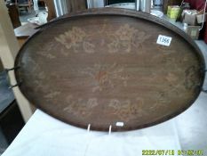 An oval mahogany inlaid tray.