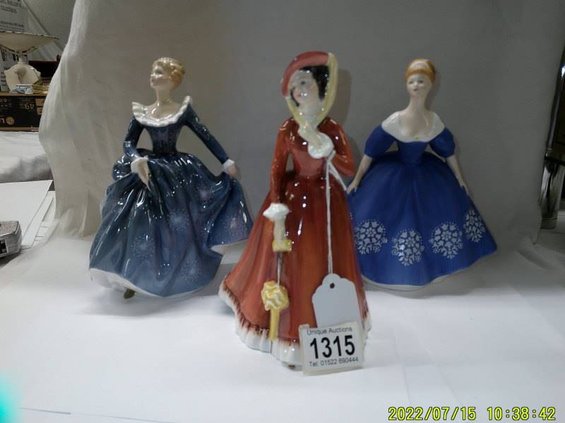 Three Royal Doulton figurines - Julia HN2705, Fragrance HN2374 and Nina Hn2347.