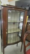 An Edwardian mahogany inlaid lead glazed display cabinet (missing glass to one side) COLLECT ONLY.