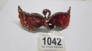 A Butler and Wilson Swan Swarovski crystal hair clip.