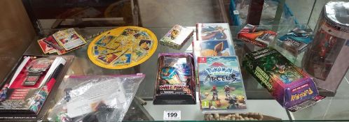 A quantity of Pokemon items including cards ,figures etc and 3 Nintendo switch games