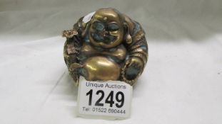 A small Chinese brass/bronze Buddha.