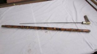 An old bamboo sword stick with horn handle, 90 cm, blade 63 cm.