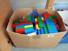 A quantity of Lego Duplo building blocks and motorised train plus track figures, animals and bushes