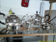 A three piece silver plate tea set, a silver plater teapot and a sugar bowl.