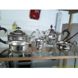 A three piece silver plate tea set, a silver plater teapot and a sugar bowl.