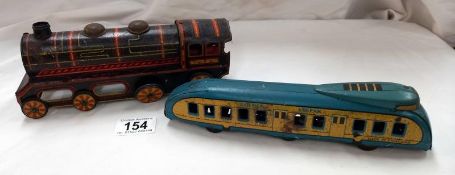 A Wells Brinton tinplate clockwork Golden streak train and a Japanese tinplate Whistling train.