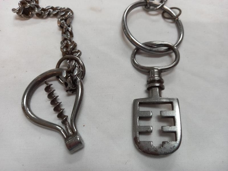 A Victorian metal chain with an antique metal key and an antique metal bottle opener - Image 2 of 2