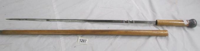 An old sword stick, 90 cm, blade 70 cm.