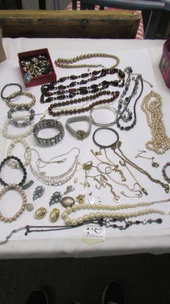 A mixed lot of necklaces, bracelets, earrings etc.,