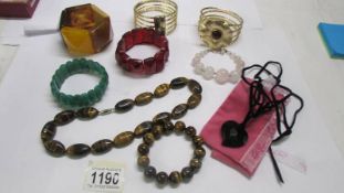 A good collection of bracelets including Lola Rose and a jade example.