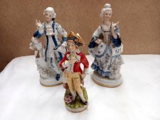 A pair of blue and white continental porcelain figures and 1 other