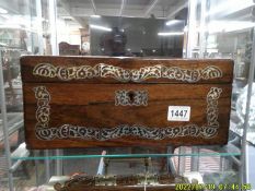 A Victorian writing box inlaid with mother of pearl.