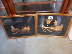 A pair of gilt framed oriental pictures made from bamboo grasses