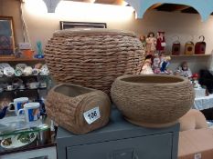 A large wicker round planter and 2 others