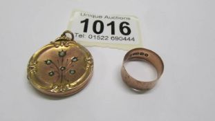 A 9ct gold Victorian locket, 6.4 grams and a 9ct gold wedding ring, 1.8 grams.