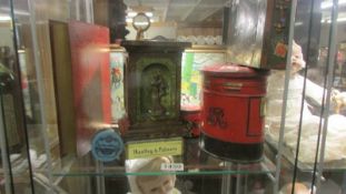 A collection of Huntley & Palmer tins including red pillar box, Grecian Style Pedestal, red book