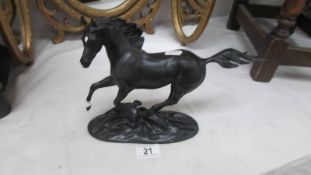 A Franklin Mint Black Beauty horse figure.