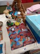 A lot of cartoon character figures and toiletries, including Disney's Aladdin, Wallace and Gromit,