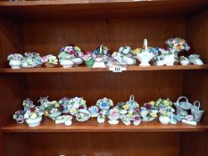 2 shelves of porcelain flower posy ornaments