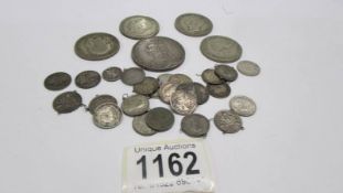 Approximately 115 grams of silver coins including Victorian crown.