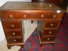A small mahogany double pedestal desk with leather inset top. COLLECT ONLY.