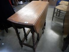 A barley twist gate leg table