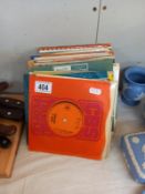 A selection of 45 rpm singles including Simon & Garfunkel, Louis Armstrong & Gracie Fields etc.