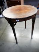 A mahogany round Victorian pad foot table