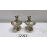 A pair of silver salts surmounted cherubs, Birmingham 1894/95.