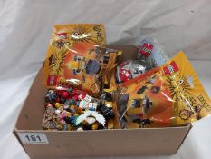 A quantity of Lego figures and 4 unopened Lego packs