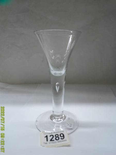 A 19th century drinking glass, 18 cm tall.