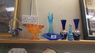 A pair of blue glass hand painted vases and other glassware.
